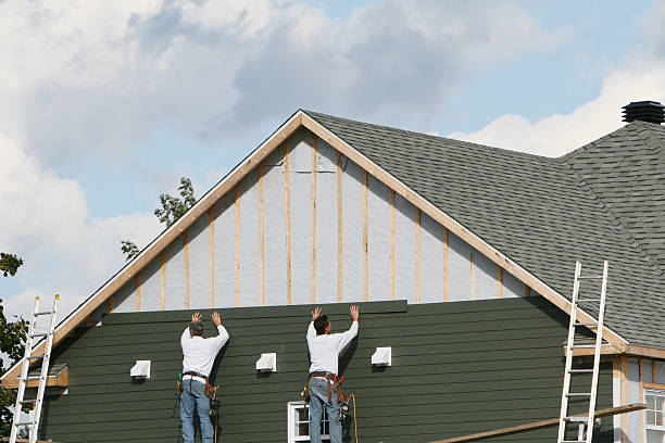 Professional Emergency Siding Repair technician working in Tiltonsville, OH